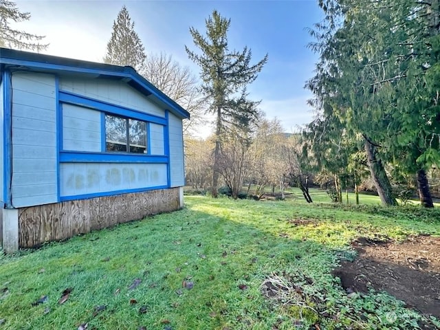 view of home's exterior featuring a yard