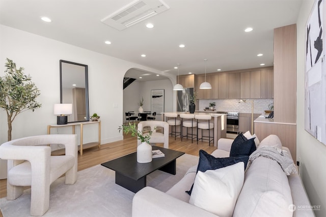 living room with light hardwood / wood-style flooring