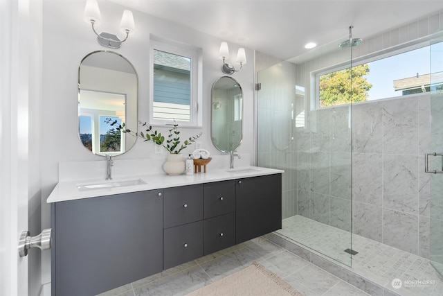 bathroom with vanity and a shower with shower door