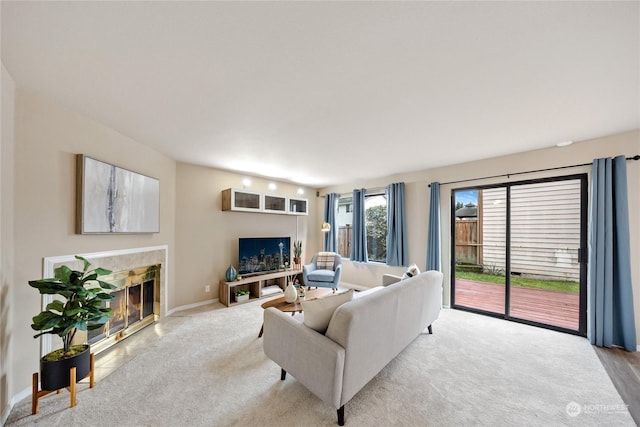 1302 3rd St SE Unit 1, Auburn, WA 98002 - carpeted living room with a tiled fireplace and baseboards