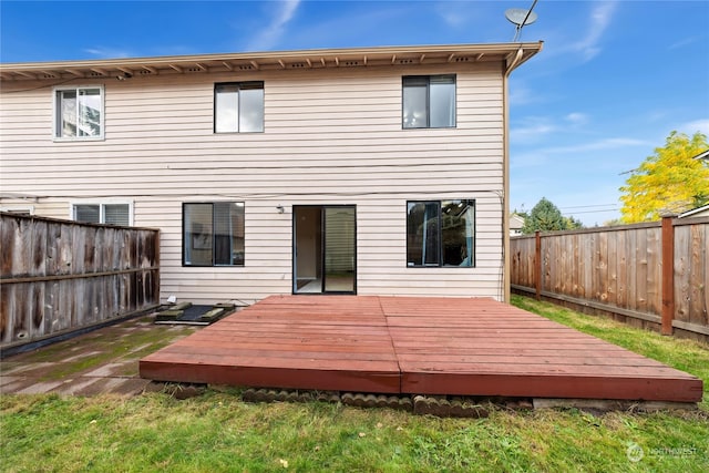 back of house featuring a wooden deck