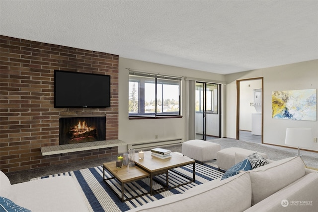 living room featuring a baseboard heating unit, a fireplace, carpet floors, and a textured ceiling