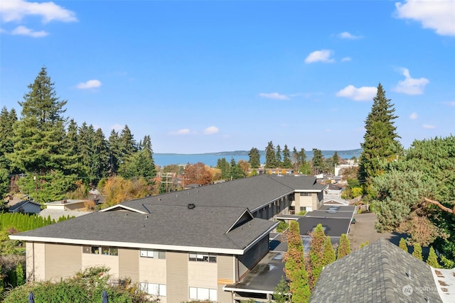 birds eye view of property with a water view