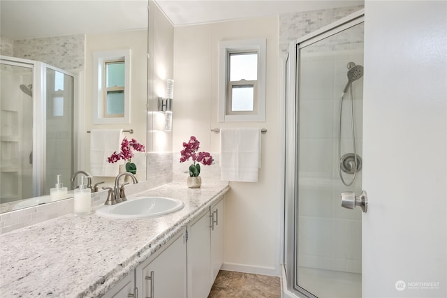 bathroom with vanity and an enclosed shower