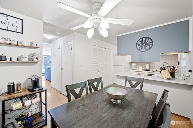 8309 Cirque Dr W Unit 7, University Place, WA 98467 - dining space featuring ceiling fan and light wood-style floors