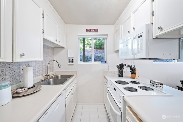 kitchen with white cabinets, a textured ceiling, sink, light tile patterned flooring, and white appliances