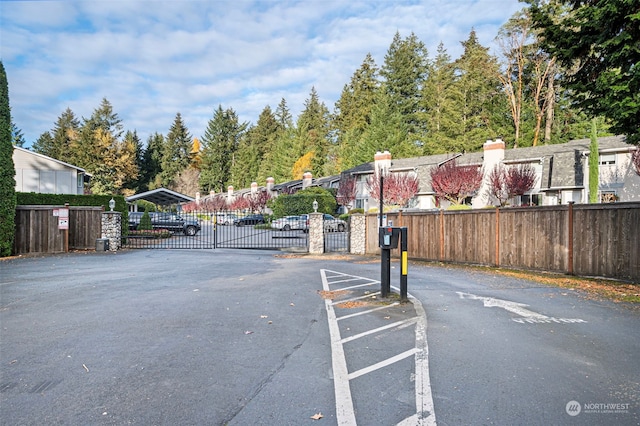 8309 Cirque Dr W Unit 7, University Place, WA 98467 - view of asphalt street featuring a gate and a gated entry