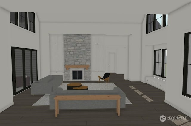 living room featuring a fireplace, a towering ceiling, and dark wood-type flooring