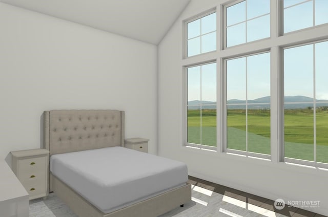 bedroom featuring a mountain view, multiple windows, and vaulted ceiling