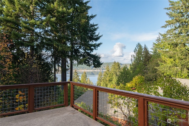 wooden deck featuring a water view