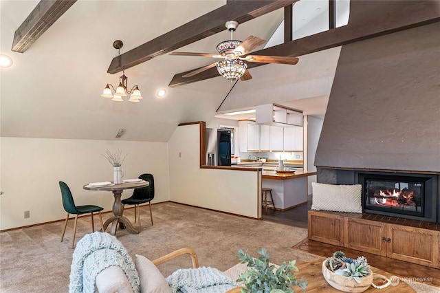 carpeted living room with lofted ceiling with beams and ceiling fan