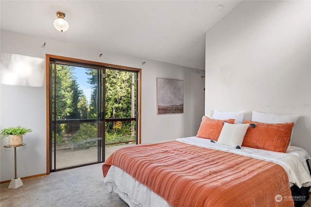 carpeted bedroom with lofted ceiling