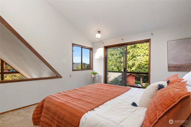 carpeted bedroom featuring access to outside and vaulted ceiling