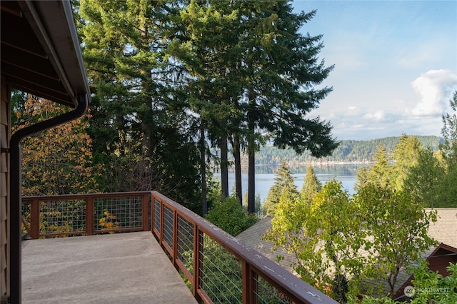 wooden terrace with a water view