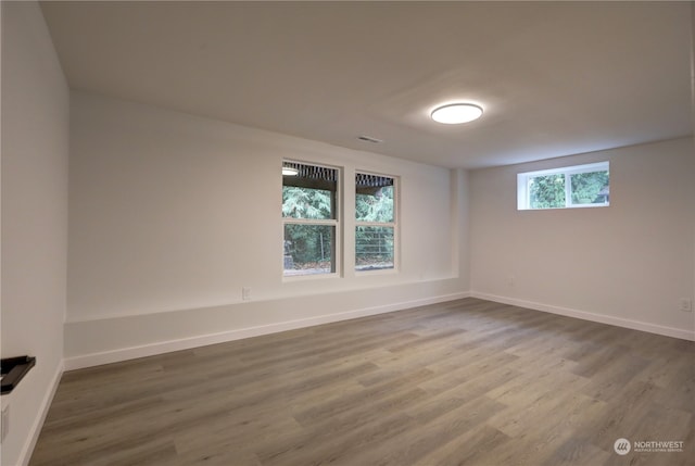 unfurnished room featuring wood-type flooring