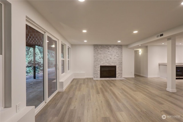 34716 169th Ave SE, Auburn, WA 98092 - unfurnished living room with wood finished floors, recessed lighting, beverage cooler, and a fireplace