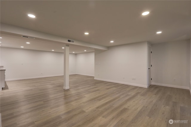 basement featuring light hardwood / wood-style flooring