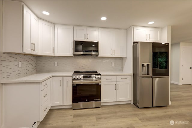 34716 169th Ave SE, Auburn, WA 98092 - kitchen featuring stainless steel appliances, light countertops, white cabinets, light wood-style flooring, and recessed lighting