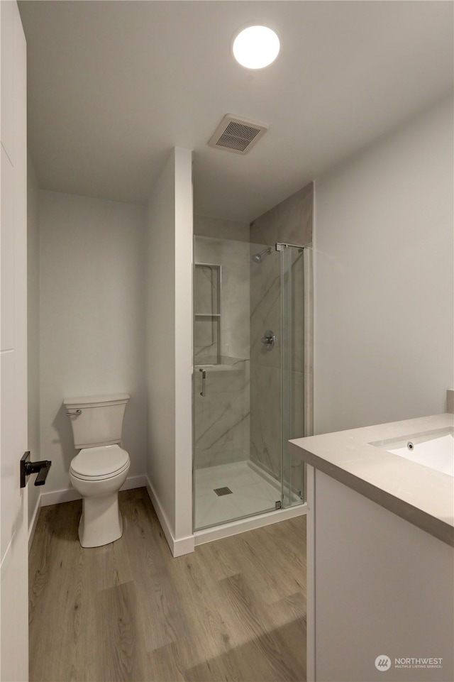 34716 169th Ave SE, Auburn, WA 98092 - bathroom featuring wood finished floors, vanity, and a shower stall