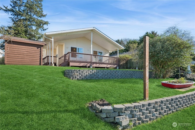 361 Lake View Loop NE, Ocean Shores, WA 98569 - rear view of property featuring a lawn and a wooden deck