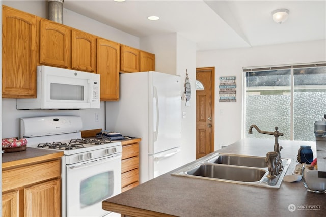 361 Lake View Loop NE, Ocean Shores, WA 98569 - kitchen featuring white appliances, a sink, and dark countertops