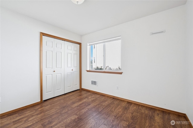 361 Lake View Loop NE, Ocean Shores, WA 98569 - unfurnished bedroom with wood finished floors, baseboards, and a closet
