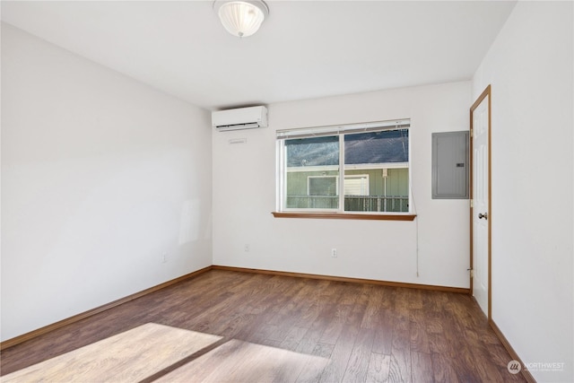 361 Lake View Loop NE, Ocean Shores, WA 98569 - empty room with electric panel, a wall mounted air conditioner, wood finished floors, and baseboards