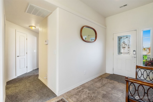 view of carpeted entrance foyer