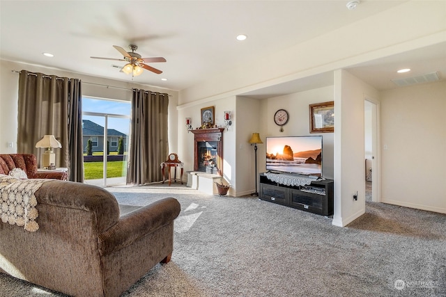 living room with carpet and ceiling fan