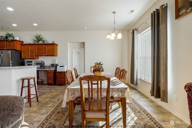 dining room with a notable chandelier