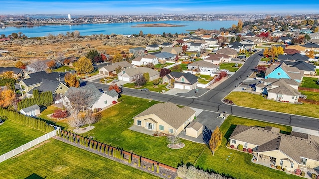 birds eye view of property with a water view