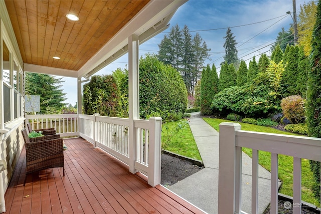 wooden deck with a yard