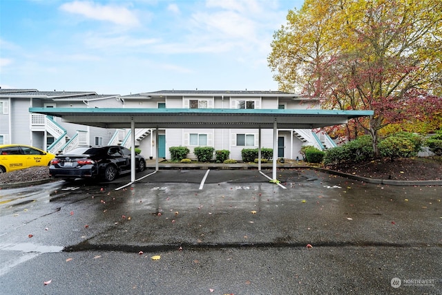 view of vehicle parking featuring a carport