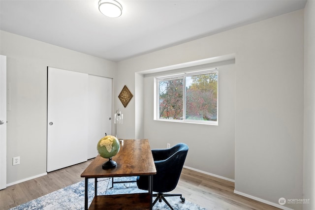 office space with light wood-type flooring