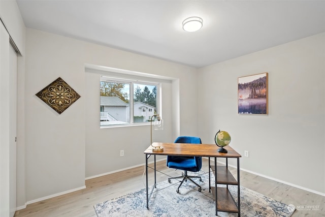 office space with light wood-type flooring