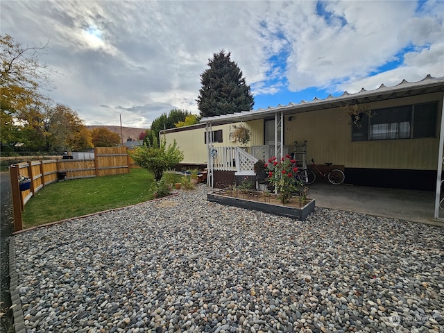 back of house featuring a yard