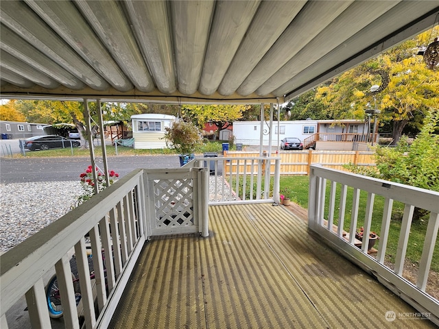 wooden deck with a yard