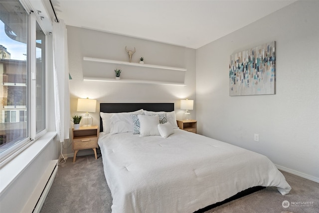 bedroom featuring a baseboard heating unit and carpet floors