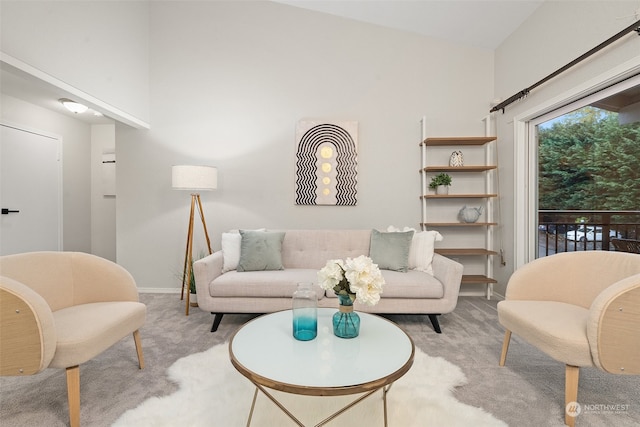 living room featuring light carpet and lofted ceiling