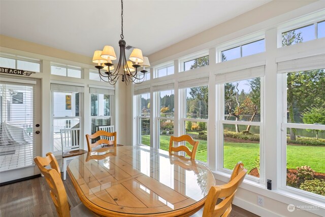 sunroom with an inviting chandelier