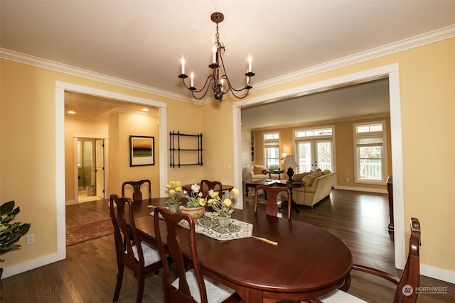 dining area with a chandelier, french doors, dark hardwood / wood-style flooring, and ornamental molding