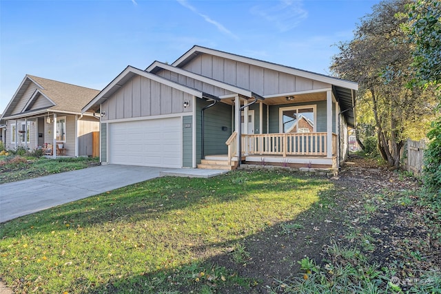 view of front of property with a garage, a porch, and a front lawn