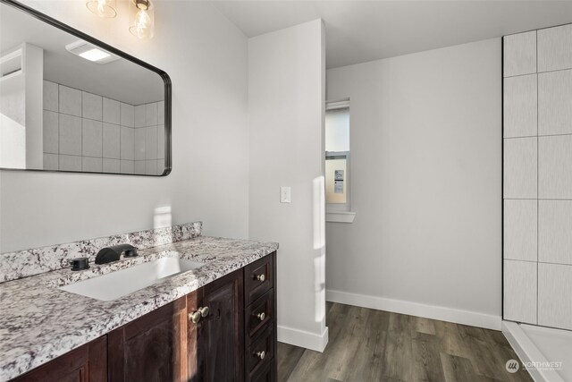 bathroom featuring vanity and wood-type flooring