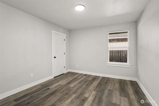 empty room featuring dark hardwood / wood-style floors