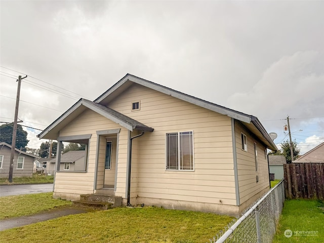 bungalow with a front lawn