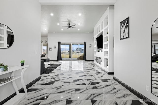 hallway with french doors, built in features, and a textured ceiling