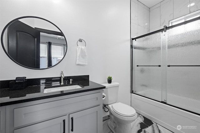 205 Clayton Pl, Mattawa, WA 99349 - full bath with marble look tiles, toilet, vanity, and enclosed tub / shower combo
