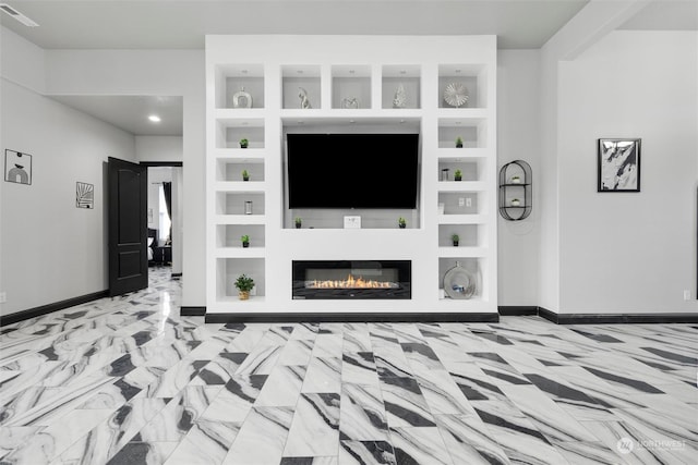 205 Clayton Pl, Mattawa, WA 99349 - unfurnished living room with baseboards, a glass covered fireplace, and built in features