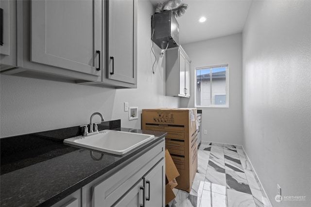 205 Clayton Pl, Mattawa, WA 99349 - laundry area featuring hookup for a washing machine, light marble finish floors, cabinet space, baseboards, and recessed lighting