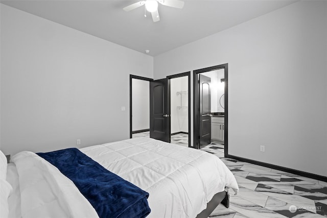 205 Clayton Pl, Mattawa, WA 99349 - bedroom with baseboards, ceiling fan, ensuite bathroom, and light marble finish flooring